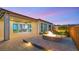 Inviting backyard features a stone patio with a cozy fire pit and seamless indoor-outdoor living at 2069 Alto Vista Dr, Henderson, NV 89052