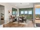 Dining room with views, the doors open to a balcony, and a bedroom can be seen through the doorway at 2069 Alto Vista Dr, Henderson, NV 89052