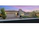Inviting single-story home showcases a well-maintained front yard and a warm, neutral facade at 2069 Alto Vista Dr, Henderson, NV 89052