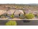 Well-maintained home with manicured landscaping, a paved driveway, and inviting curb appeal at 2069 Alto Vista Dr, Henderson, NV 89052