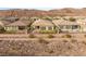 Beautifully landscaped home with a private backyard, complete with artificial turf and a cozy fire pit at 2069 Alto Vista Dr, Henderson, NV 89052