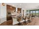 Modern kitchen with granite countertops, stainless steel appliances, and sleek bar stool seating at 2069 Alto Vista Dr, Henderson, NV 89052