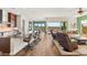 Spacious living room featuring hardwood floors, a modern kitchen, and an expansive outdoor view at 2069 Alto Vista Dr, Henderson, NV 89052