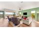 Inviting living area boasts hardwood floors, neutral furniture, and sliding doors to a scenic patio at 2069 Alto Vista Dr, Henderson, NV 89052