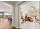 Bright, open-concept living area with hardwood floors, a ceiling fan, and large windows with natural light at 2069 Alto Vista Dr, Henderson, NV 89052
