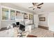Spacious office with custom built-in shelving, cabinets, and desk space with natural light at 2069 Alto Vista Dr, Henderson, NV 89052