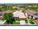 Aerial view of a single-Gathering home with manicured lawn and mature trees nestled in a suburban neighborhood at 2113 Scarlet Rose Dr, Las Vegas, NV 89134