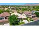 Overhead view of a single-Gathering home surrounded by lush landscaping and a beautiful mountain backdrop at 2113 Scarlet Rose Dr, Las Vegas, NV 89134