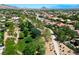 Scenic aerial view of the neighborhood showcasing walking trails, green spaces and mountain views at 2113 Scarlet Rose Dr, Las Vegas, NV 89134