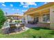 Beautiful backyard with a pool, patio seating, and well-maintained landscaping for relaxation at 2113 Scarlet Rose Dr, Las Vegas, NV 89134