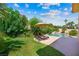 Lush backyard featuring a swimming pool, rock features, and beautiful landscaping at 2113 Scarlet Rose Dr, Las Vegas, NV 89134