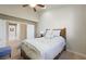 Cozy bedroom with vaulted ceilings, white linens, and wooden furniture at 2113 Scarlet Rose Dr, Las Vegas, NV 89134