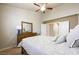 Bright bedroom with vaulted ceiling, walk through to hallway, and classic wooden furniture at 2113 Scarlet Rose Dr, Las Vegas, NV 89134