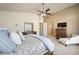Comfortable main bedroom with plush bedding, dresser, and a relaxing reading chair at 2113 Scarlet Rose Dr, Las Vegas, NV 89134
