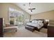 Light-filled main bedroom with high ceilings and views of the outdoor pool area at 2113 Scarlet Rose Dr, Las Vegas, NV 89134