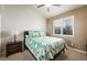 Comfortable bedroom with tropical decor and natural light from plantation shutters at 2113 Scarlet Rose Dr, Las Vegas, NV 89134