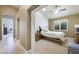 Comfortable bedroom with ceiling fan, natural light, and view to hallway at 2113 Scarlet Rose Dr, Las Vegas, NV 89134