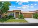 Charming single-story home featuring a well-manicured lawn and attached two-car garage at 2113 Scarlet Rose Dr, Las Vegas, NV 89134
