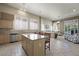 Well-lit kitchen connects to a living area and offers an island with counter seating at 2113 Scarlet Rose Dr, Las Vegas, NV 89134