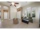 Cozy living room featuring tile floors, plantation shutters, and neutral paint at 2113 Scarlet Rose Dr, Las Vegas, NV 89134