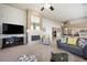 Comfortable living room features a fireplace, plush seating, and modern entertainment center at 2113 Scarlet Rose Dr, Las Vegas, NV 89134