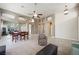 Spacious living room with tile and carpet, featuring an open concept layout with updated kitchen at 2113 Scarlet Rose Dr, Las Vegas, NV 89134
