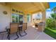 Covered patio area with seating, offering an ideal space for outdoor dining and relaxation at 2113 Scarlet Rose Dr, Las Vegas, NV 89134