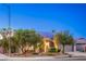 Lovely single-story home boasts mature trees, a well-manicured lawn, a solar panel system, and a side entry two-car garage at 2158 High Mesa Dr, Henderson, NV 89012