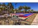 Community shuffleboard court with tables, chairs and shade structures, perfect for enjoying the outdoors at 2158 High Mesa Dr, Henderson, NV 89012
