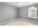 Bright bedroom with plank flooring, a window, neutral walls, and standard baseboards at 2251 Wigwam Pkwy # 211, Henderson, NV 89074