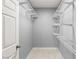 Spacious walk-in closet featuring wire shelving and tile floors for organized storage at 2251 Wigwam Pkwy # 211, Henderson, NV 89074