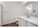 Bright bathroom featuring a white vanity with a large mirror and a glass-enclosed shower with tile surround at 25 Barbara Ln # 42, Las Vegas, NV 89183