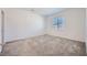 Bright, spacious bedroom with plush carpet and large window offering plenty of natural light at 25 Barbara Ln # 42, Las Vegas, NV 89183
