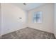 Well-lit bedroom featuring plush carpeting, a window for natural light, and ample space at 25 Barbara Ln # 42, Las Vegas, NV 89183
