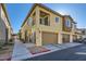 Inviting two-story home featuring a private balcony, garage, and charming architectural details at 25 Barbara Ln # 42, Las Vegas, NV 89183