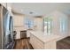 Bright, open kitchen with white cabinets, stainless steel appliances, and a quartz island at 25 Barbara Ln # 42, Las Vegas, NV 89183