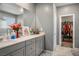 Bathroom features a double vanity with plenty of storage and a door to the walk-in closet at 2577 Tolmezzo St, Henderson, NV 89044