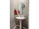 Elegant bathroom featuring a pedestal sink with a modern chrome faucet at 2577 Tolmezzo St, Henderson, NV 89044