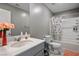 Bathroom featuring a vanity with a quartz countertop and tub with shower at 2577 Tolmezzo St, Henderson, NV 89044