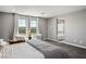 Bright bedroom with plush carpeting, large windows, and a view of the surrounding landscape at 2577 Tolmezzo St, Henderson, NV 89044