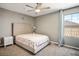 Cozy bedroom featuring neutral decor, carpeted floors, and a ceiling fan at 2577 Tolmezzo St, Henderson, NV 89044