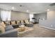 Bonus room featuring a sectional sofa, carpet, and neutral color palette at 2577 Tolmezzo St, Henderson, NV 89044