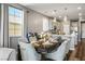 The dining and kitchen area features pendant lighting, counter seating, and plenty of natural light at 2577 Tolmezzo St, Henderson, NV 89044