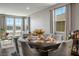 Dining area features modern furnishings, sleek hardwood floors, and soft, natural light at 2577 Tolmezzo St, Henderson, NV 89044