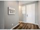 Inviting entryway with hardwood floors, neutral wall paint, and a charming elephant artwork at 2577 Tolmezzo St, Henderson, NV 89044