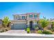 Charming two-story home featuring a well-manicured lawn, tile roof and a two-car garage at 2577 Tolmezzo St, Henderson, NV 89044