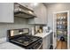 Well-organized kitchen with stainless steel appliances, a gas range, quartz countertops, and a walk-in pantry at 2577 Tolmezzo St, Henderson, NV 89044