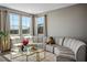 Bright living room featuring a large sectional sofa and modern coffee table at 2577 Tolmezzo St, Henderson, NV 89044