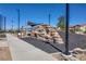 Community park featuring a unique rock climbing area and walking path at 2577 Tolmezzo St, Henderson, NV 89044