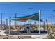 The community playground features climbing structures and sunshades for a fun, safe, and enjoyable play area at 2577 Tolmezzo St, Henderson, NV 89044